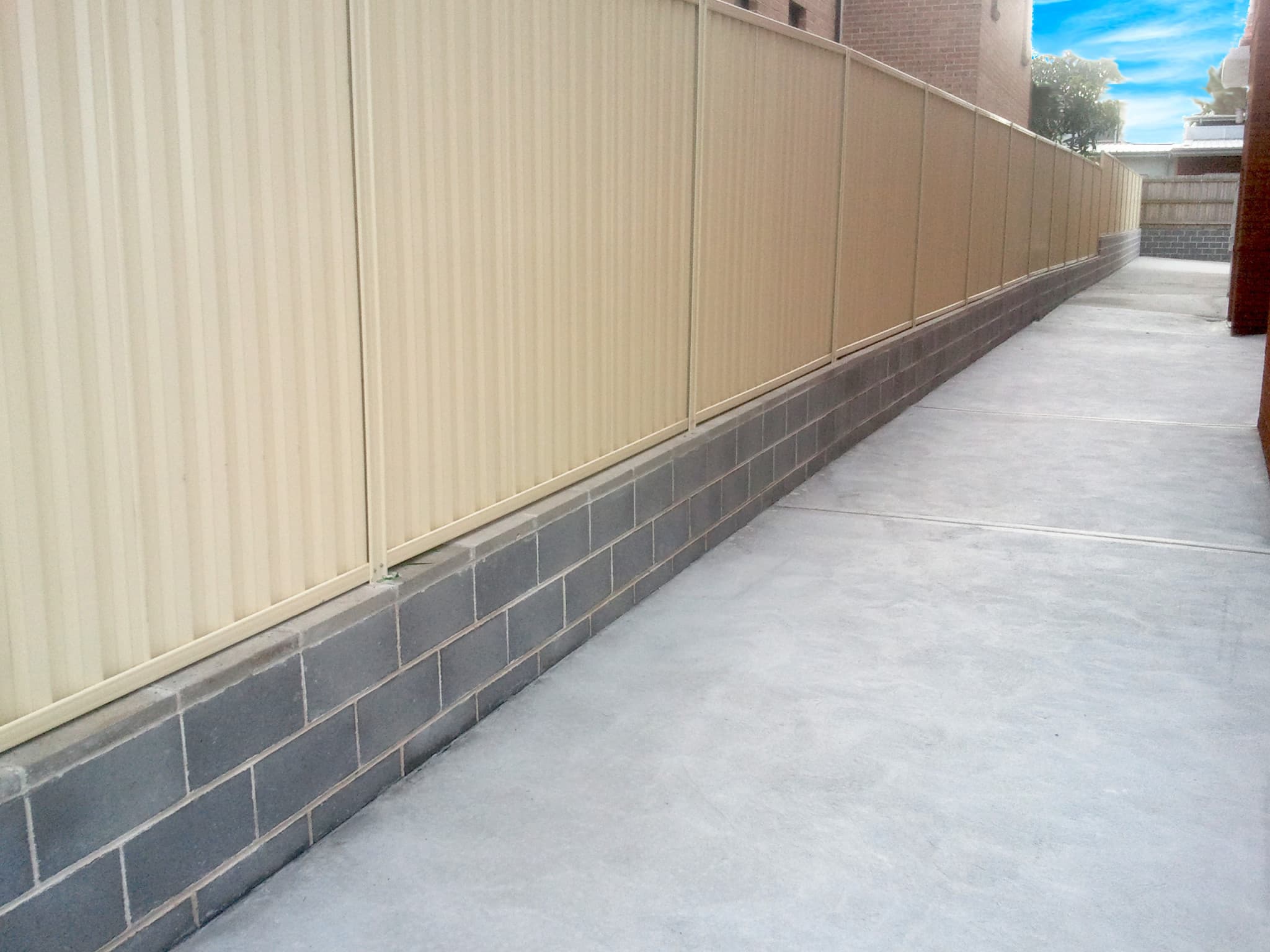 Installation of a retaining wall and fence in Belmore